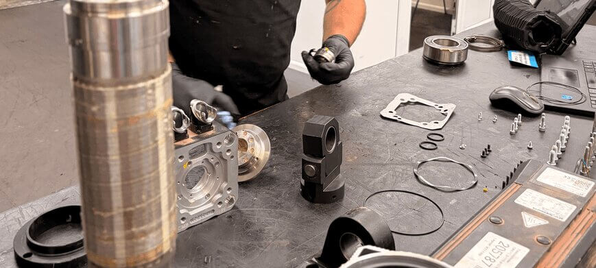 Technician working on a car part
